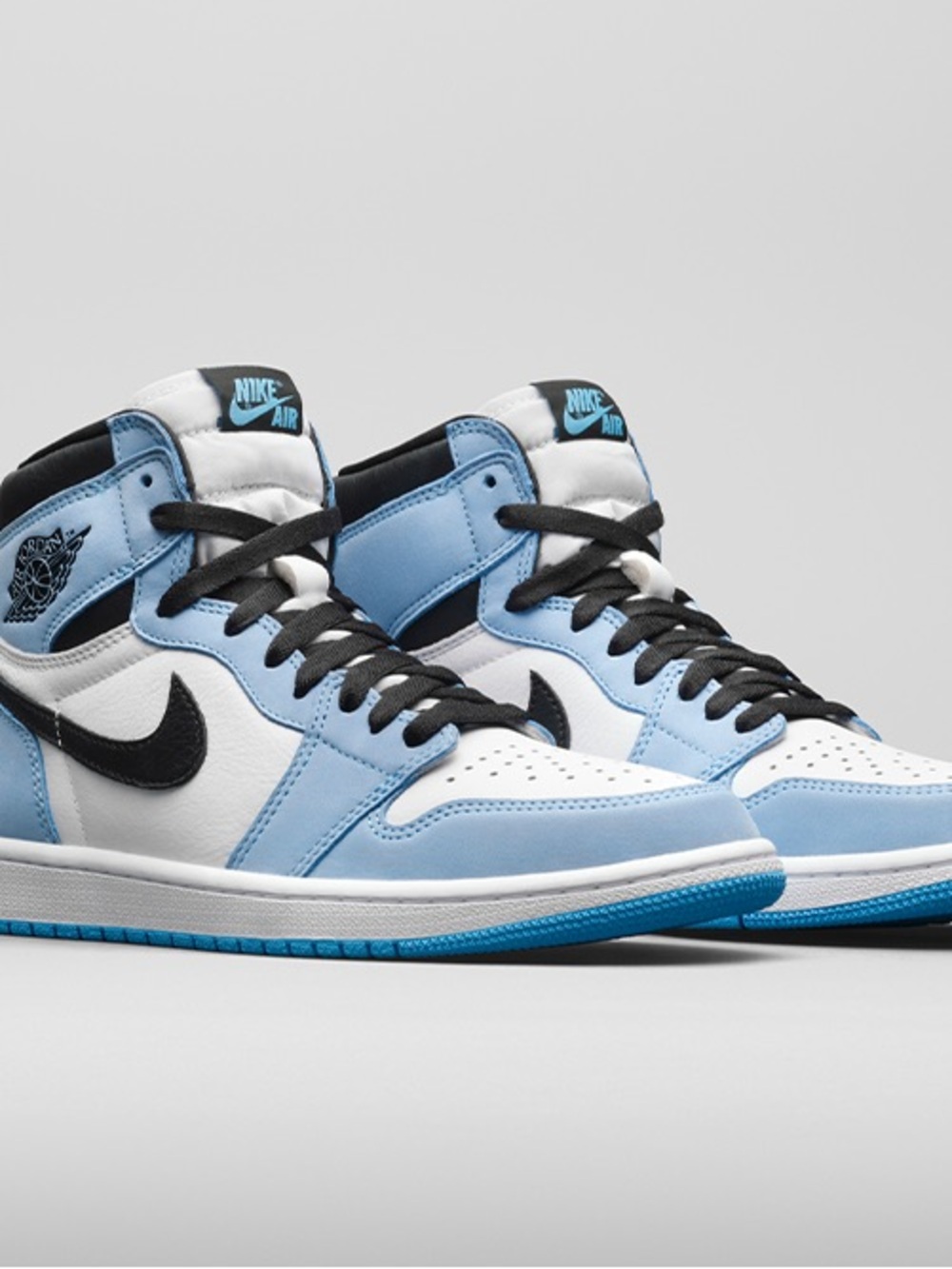 Nike Air Jordan 1 Mid — White & Light Blue with Black Accents